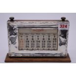 A silver desk calendar, by W J Myatt & Co, Birmingham 1928, 21cm wide.