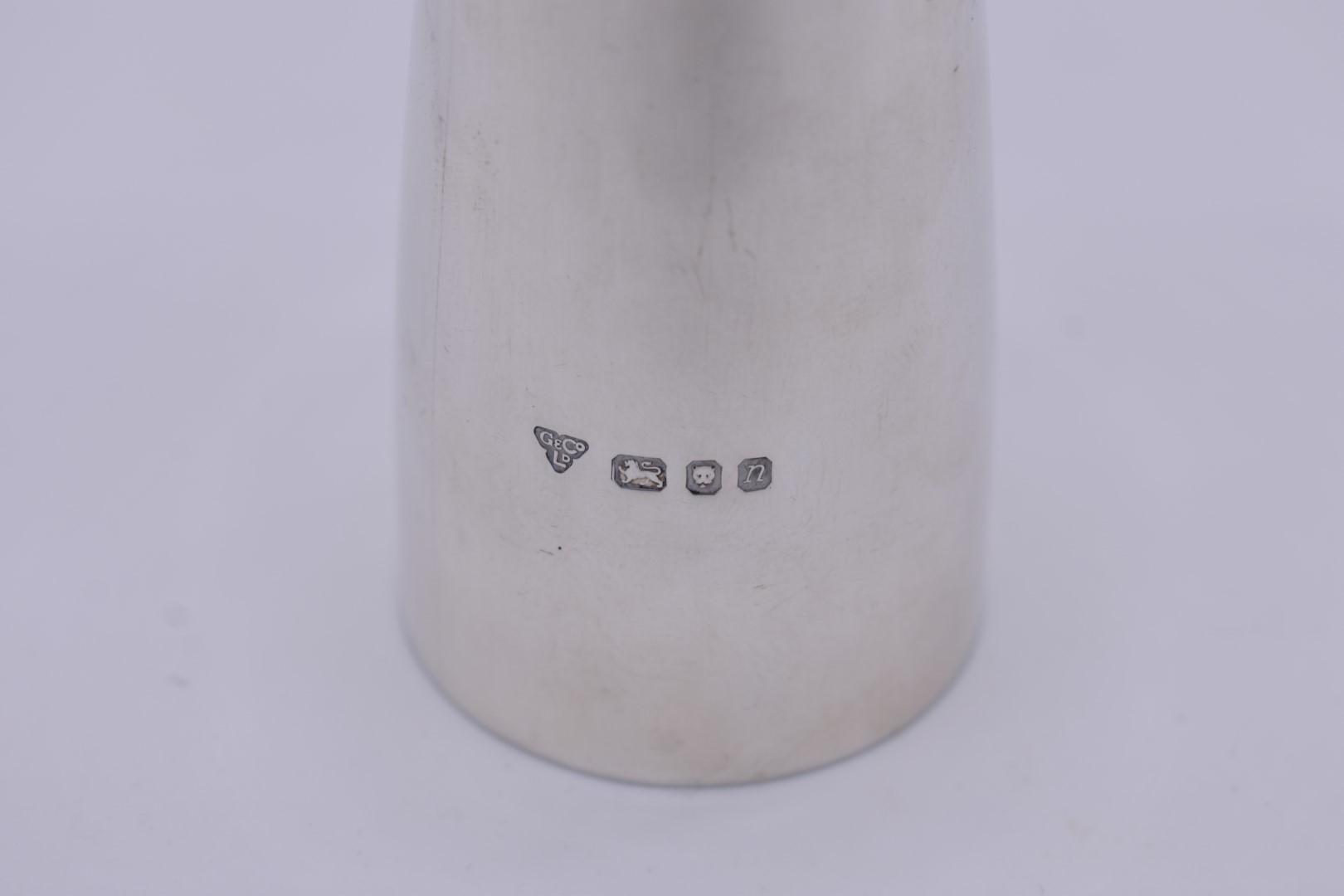 A silver pepperette, by Garrard & Co Ltd, London 1968, 13.3cm, 228g. - Image 3 of 4