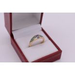 A tanzanite and opal ring, stamped '14k Kabana'.