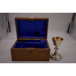 A modern unmarked metal travelling communion chalice, engraved cross to base and having gilded bowl,
