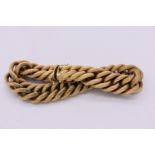 An Italian designer 18k gold textured twist bracelet, by Nicolis Cola, 20cm long x 1.5cm wide, 45g.