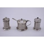 An engine turned silver three piece cruet set, by Sanders & Mackenzie, Birmingham 1932/3.