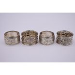 A pair of silver napkin rings, by Mappin & Webb, London 1901, 39g; together with another pair by