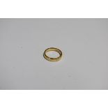 An 18ct gold wedding band, 5g.