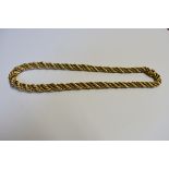 An 18ct yellow and white gold rope twist choker necklace, import mark London 1966,