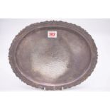 An Eastern metal oval tray, stamped 'Silver', 31cm.