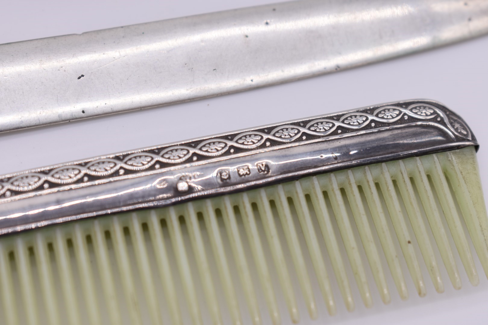 A sterling silver swizzle stick; together with a .800 letter opener; a silver mounted comb; and - Image 3 of 4