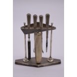 An engine turned silver vanity stand, by M Emanuel, Birmingham 1934/7, height of stand 13.7cm.