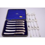 A small quantity of silver coffee spoons, 97g; together with a cased set of six silver handled tea