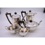 A silver five piece teaset, by Walker & Hall, Sheffield 1924-8, 1843g gross.