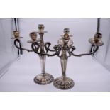 A pair of sterling silver candelabra, filled, 36cm, (a.f).