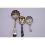 A silver shell caddy spoon, by Josiah Williams & Co, London 1915; together with a silver sifter
