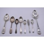 A small quantity of silver cutlery, to include: a Georgian picture back teaspoon, 190g.