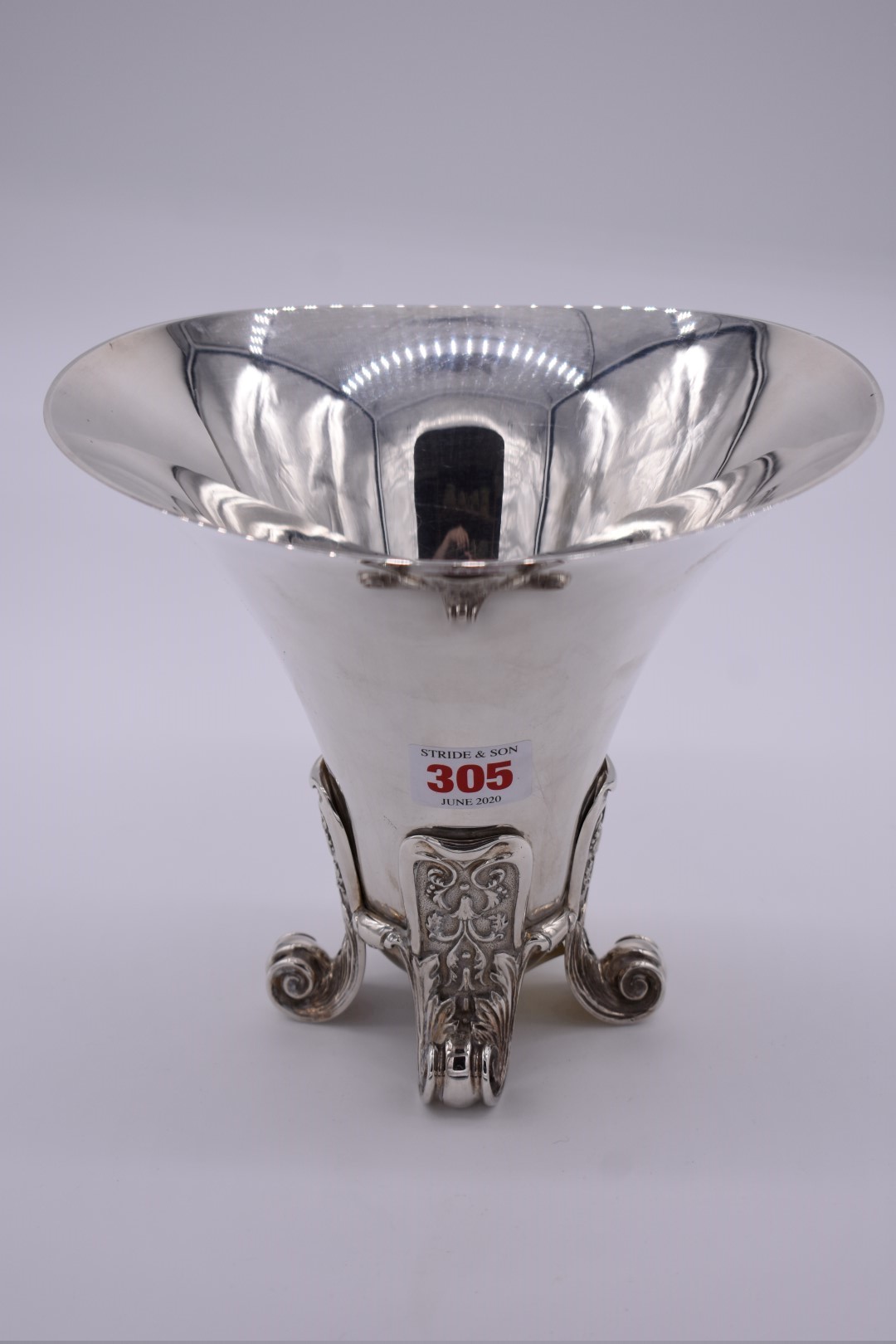 A heavy silver vase, by Asprey & Co Ltd, London 2002, having flared rim, on four scroll supports