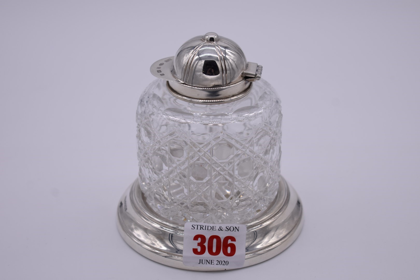 A silver mounted cut glass inkwell having jockey's cap lid, by Laurence R Watson & Co, Sheffield