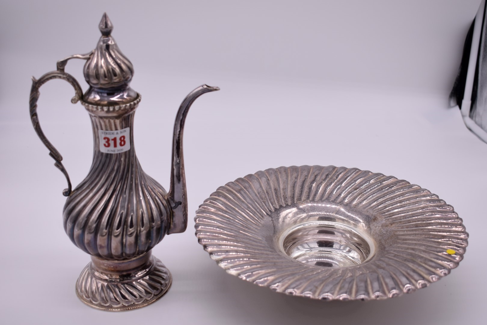 A Turkish metal ewer and basin, stamped 900, maker A L., 32cm high.