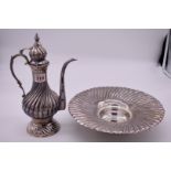 A Turkish metal ewer and basin, stamped 900, maker A L., 32cm high.