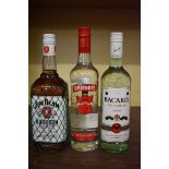 Three bottles of spirits, comprising: a 1 litre Jim Beam Bourbon; a 70l Smirnoff vodka; and a 70cl