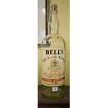 An old 8 pint Bell's whisky bottle, (no contents).