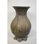 A large Chinese Archaistic bronze vase, relief mark to base, of moulded form with stylized