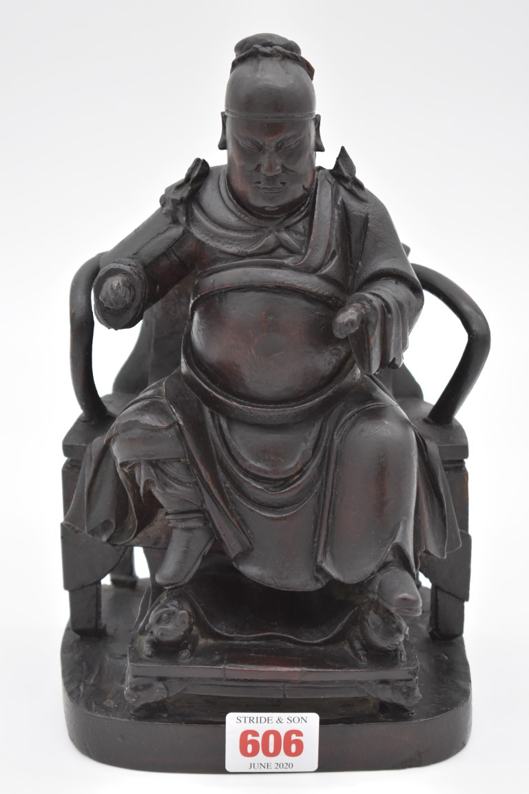 A Chinese carved wood seated emperor, 19th century, 23.5cm high.