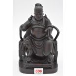 A Chinese carved wood seated emperor, 19th century, 23.5cm high.