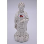 A Chinese blanc de chine standing Buddah, 19th century, 26.5cm high, (s.d.).