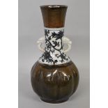 An unusual Chinese or Japanese twin handled baluster vase, six character seal mark to base, the body