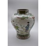 A Chinese famille verte inverted baluster jar, Qing, painted with a continuous band of figures in