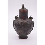 WITHDRAWN FROM SALE A Chinese Archaistic bronze swing handled wine vessel and cover Hu,