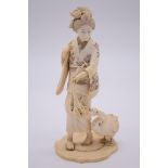 A good Japanese carved ivory okimono of a lady with a goose, Meiji, signed on tablet to base, 22cm