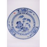 A Chinese blue and white charger, 18th century, painted with flowering branches, 37.5cm diameter, (