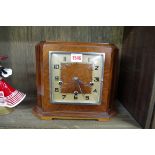 A 1930s Art Deco walnut striking mantel clock, by Enfield, 24cm high, with key.