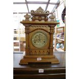 A 19th century American oak mantel clock, by 'Newhaven Clock Co', striking on gong, with pendulum,