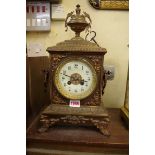 A late 19th century French brass striking mantel clock, 40cm, with pendulum and key.