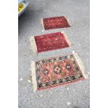 Two similar Bokhara prayer mats, together with one other prayer mat.