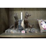 A pair of Art Deco bronzed spelter and marble dog bookends, largest 19cm high.