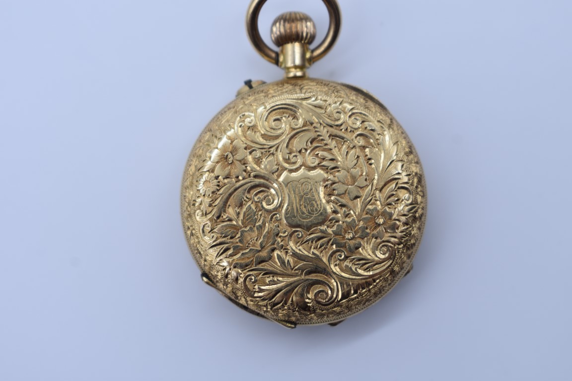 A chased gold stem wind fob watch, stamped 18k, having enamel dial and Roman numerals, 3cm diameter, - Image 3 of 4