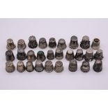 An interesting collection of silver thimbles, 114g; together with six others. (28)