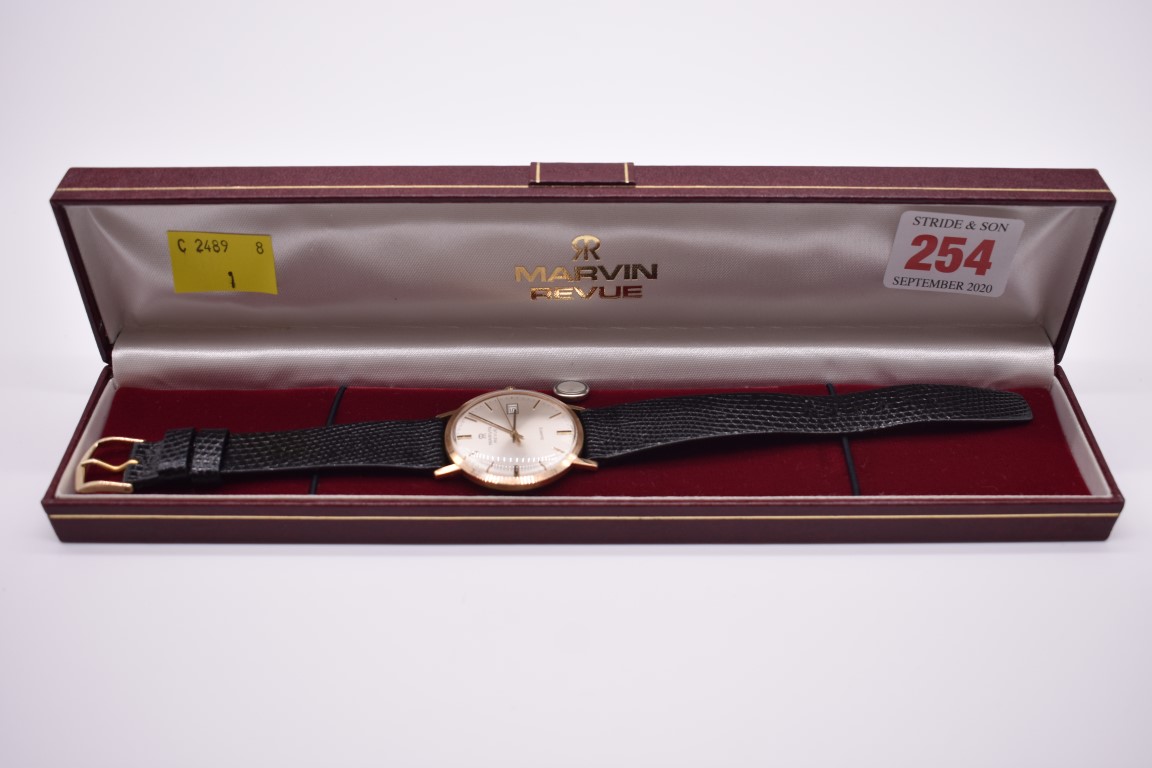 A Marvin 'Revue' 9ct gold quartz wristwatch, 32mm, cal.ETA  555 415, on original leather strap, with