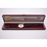 A Marvin 'Revue' 9ct gold quartz wristwatch, 32mm, cal.ETA  555 415, on original leather strap, with
