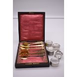 A cased part set of nine French .800 silver gilt coffee spoons; together with five various silver