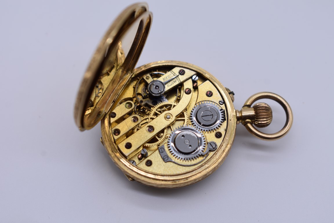 A chased gold stem wind fob watch, stamped 18k, having enamel dial and Roman numerals, 3cm diameter, - Image 4 of 4