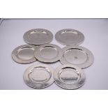 Six various white metal presentation salvers, stamped .800.