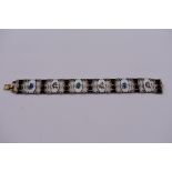 A Norwegian silver gilt and enamel bracelet, by Ivar T Holth, having alternating black and floral