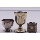 An Edwardian silver egg cup, by Wakely & Wheeler, London 1905, 47g; together with a Dutch white