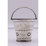 A George III pierced silver swing handle sugar pail, by Samuel Godbehere & Edward Wigan, London