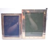 A silver photograph frame, by Kitney & Co, London 2000, 25 x 20cm; together with another, 22 x 17cm.