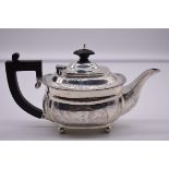 A silver bachelor's teapot, by Harrods Ltd, London 1924, 11cm high, 392g total weight.