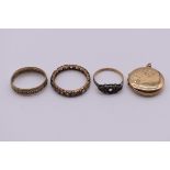 Two gold gem set rings, hallmarked 375; together with an unmarked eternity ring; and a 9ct gold back